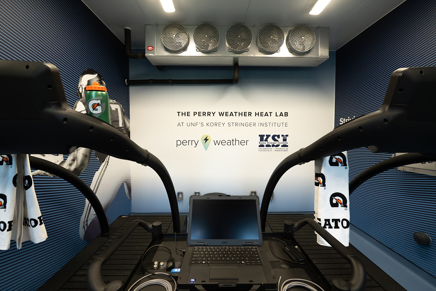 treadmills in front of the graphics wall at the Perry Weather Heat Lab