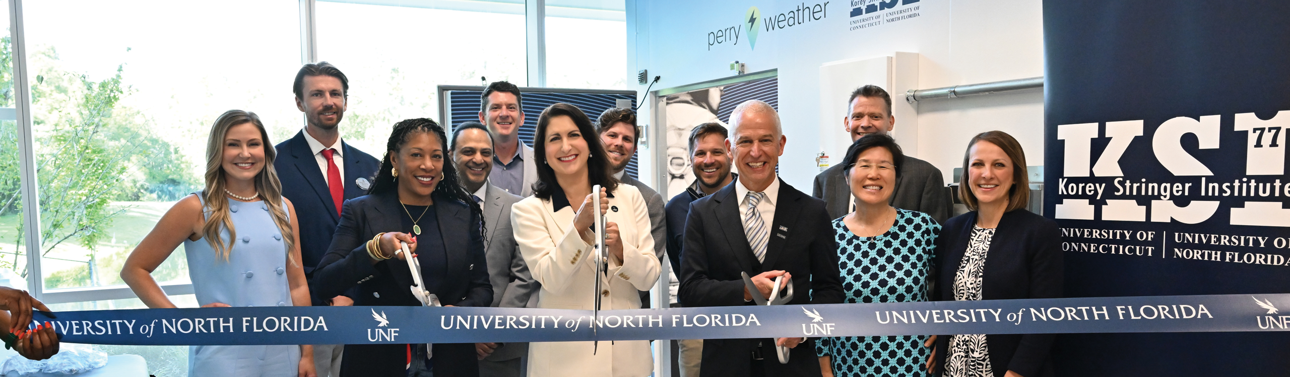 cutting the ribbon at the grand opening